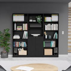 a living room with bookshelves and a coffee table in front of the couch