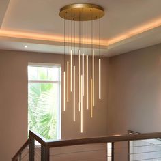 a modern chandelier hanging from the ceiling