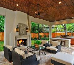 an outdoor living room with furniture and fireplace in the center is featured on instagram