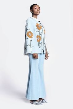 Ice blue cape with contrast sunflower embroidery. Paired with bell bottom pant. - Aza Fashions Embroidery Sunflower, Cape For Women, Blue Cape, Denim Embroidery, Pant For Women, Blue Bell, Trouser Pants Women, Bell Bottom Pants, Washed Denim