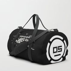 a black duffle bag with white and black logos on the front, side view