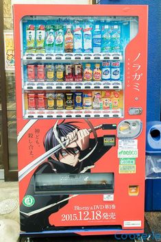 a vending machine for drinks with an anime character on it's front and side