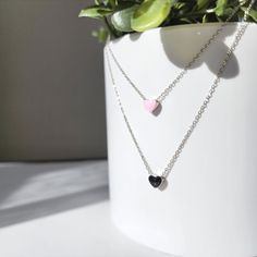 Nuestros mini collares de corazón están hechos con un colgante de corazones esmaltados de plata de ley 925 y una cadena de plata 925 que es buena para pieles delicadas. Tenemos disponibles un collar de corazón de esmalte rosa y un collar de corazón rojo y negro.

 Tamaño: la longitud del collar es de aproximadamente 16" de largo con una cadena extendida de 1,5"

 💖 Hipoalergénico

 🎀 Lindo y delicado

 🎁 Regalo listo

 🌹Hecho a mano con amor

 💨Embalaje:

 • Bien embalado en caja reciclable

 • Viene con una bolsa de seda con cordón

 💨Instrucciones de cuidado:

 • Evite perfumes/aerosoles

 • Manténgalos alejados de la humedad.

 • Limpie las joyas para eliminar los aceites y evitar el deslustre.

 • Guarde las joyas en un lugar fresco y seco. Las bolsas de plástico funcionan bien. Silver Charm Necklace For Valentine's Day, Trendy Silver Charm Necklace For Valentine's Day, Valentine's Day Silver Charm Necklace With Delicate Chain, Valentine's Day Stainless Steel Jewelry With Delicate Chain, Trendy Sterling Silver Heart Pendant Charm Necklace, Trendy Sterling Silver Charm Necklace With Heart Pendant, Dainty Stainless Steel Jewelry For Valentine's Day, Trendy Black Sterling Silver Jewelry, Black Stainless Steel Heart Pendant Necklace