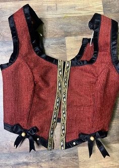 Step into a fantasy world with this Dracula-inspired bodice! Sturdy fabric and reed boning offers support, while decorative trim, velvet ribbons, and pearls add a touch of dark sophistication. Laces in front, with adjustable laced straps for added flexibility! Perfect for renaissance festivals, cosplays, or just everyday wear! Made from upcycled fabric. Available in sizes XXS-3XL Please message with any questions, concerns, additional sizing info, etc! Fantasy Fitted Overbust Costumes, Fitted Fantasy Corset-style Costume, Fitted Fantasy Costume With Underbust Style, Fitted Historical Costumes For Medieval Festivals, Fitted Corset For Cosplay Events And Costume Parties, Fitted Corset For Costume Party And Cosplay, Gothic Fitted Underbust Costume, Fitted Historical Costume For Fantasy Events, Fitted Historical Costume For Larp