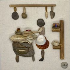 a painting with rocks and shells on it