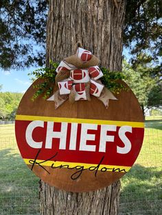 a sign that says chiefs hanging on a tree