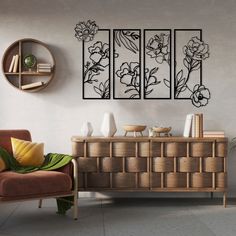 a living room with a couch, chair and art work on the wall