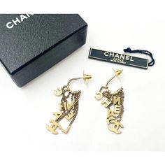 This is part of Chairish’s Costume Jewelry assortment.  Chanel Rare Vintage Gold CC Letter Dangle Hoop Earrings  *Marked 02 *This early style doesn't come with the hallmark. *Comes with the original box and the tag with style number  -It is approximately 2" x 0.5". -It is very rare and beautiful. -In an excellent condition Designer Dangle Earrings For Formal Events, Designer Dangle Earrings For Formal Occasions, Designer Metal Drop Earrings, Designer Pierced Dangle Jewelry, Designer Dangle Earrings For Gift, High-end Gold Earrings For Gift, Designer Single Metal Earring, Luxury Dangle Hoop Earrings For Formal Occasions, Designer Drop Earrings For Pierced Ears