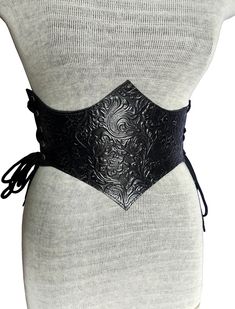 "It is Handmade leather corset with embossed beautiful designs. Handmade and hand dyed belt with high quality leather. It is adjustable with lace.  MEASUREMENTS: S/M : 66 cm - 74 cm / 26\" in - 29\"in M / L: 75 cm-85 cm / 29.5 \"in - 33.5\" in L / XL: 85 cm-95  cm / 33.5 \"in - 37.4\" in XXL: 95 cm-105 cm / 37.4 \"in - 41.3\" in DETAILS: ► 100% handmade ► 100% genuine leather ► Made on your measurements ► Unique design ► Battle ready ► LARP standard ► Worldwide delivery NOTE: This item can be personalized on request (contact us). Please update me your contact number and email address when you order, becuase I have to provide these contact details to courier when I send the parcel. We remind our customers that you can find the MEASURES of the items in the description. It is your responsibil Black Medieval Underbust Corset Belt, Fitted Festival Corset With Belt, Black Fitted Medieval Corset Belt, Black Medieval Corset Belt For Larp, Fitted Corset Belt For Costume, Medieval Style Corset Belt For Festivals, Medieval Corset Belt For Festivals, Medieval Black Corset Belt For Festivals, Gothic Adjustable Corset Belt With Belt Included