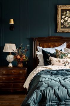 a bed in a bedroom with blue walls and wooden furniture, along with a painting on the wall