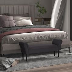 a large bed sitting on top of a wooden floor