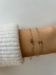 This dainty crystal bracelet is perfect for the minimalist. Labradorite is a magical stone that has an ethereal flash that can be golden, blue, green pink or purple. D E T A I L S  *It features an AAA quality blue flash labradorite gemstone . These are beautifully cut to achieve maximum sparkle. *Choose between a single stone or a trio of small ones. *The stones has been wire wrapped to a dainty stainless steel chain. Choose between 14k gold, rose gold or silver. *Stainless steel does not tarnis Dainty Crystal Bracelet With Adjustable Chain, Minimalist 14k Gold Filled Bracelets With Gemstones, Dainty Gemstone 14k Gold Filled Bracelets, Dainty Labradorite Jewelry For Everyday, Handmade Minimalist Crystal Bracelet, Dainty Moonstone Bracelets For Everyday, Minimalist Rose Gold Bracelet With Gemstone, Minimalist Adjustable Gemstone Chain Bracelet, Minimalist Rose Gold Gemstone Bracelet