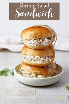 three chicken salad sandwiches stacked on top of each other in a white bowl with text overlay