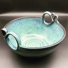 a blue bowl sitting on top of a table