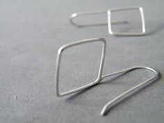 "I'd never guessed I could love geometry so much! My geometric collection is enriched by these sterling silver square earrings, lovingly handmade using silver wire. Minimalist and comfortable, are a great piece of jewelry to add style and edge to your look. Original gift idea for someone special! Measures/Details - earrings height 1.4 inches (3.5 cm) - square measures 0.6 by 0.6 inches (1.5 x 1.5 cm) All my pieces are carefully handmade. Irregularities and imperfection are signs of authenticity. Handmade Square Minimalist Jewelry, Square Minimalist Jewelry For Everyday, Hypoallergenic Square Sterling Silver Jewelry, Minimalist Square Hypoallergenic Jewelry, Minimalist Hypoallergenic Square Jewelry, Minimalist Silver Square Jewelry, Silver Square Everyday Earrings, Nickel-free Square Minimalist Earrings, Minimalist Silver Rectangular Earrings