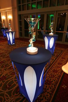 the tables are decorated with blue and white lights