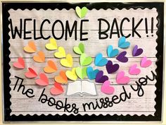 a bulletin board with hearts and the words welcome back