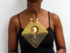 African Brass necklace, Brass jewelry, African jewelry for women, Tribal necklace, One size fits all, Christmas Gift for her, Moms gift The necklace is handcrafted using brass metal. Length: 9 inches Shipping fee is for the first item only, additional items ship for FREE. DHL Express shipping with 3-5 days delivery. To view our brass collection, click here: https://www.etsy.com/shop/NkoroiCrafts?ref=simple-shop-header-name&listing_id=1295061994&section_id=39639351 *Care instructions* Brass tarnishes with exposure to moisture and oxidation. To clean it, kindly use a lemon wedge. Squeeze the juice and polish along the surface with a clean cloth. Costume Jewelry Choker Necklaces For Gifts, Adjustable Dangle Necklaces For Celebration, Metal Choker 16 Inch Length As Gift, Metal Choker Gift, 16 Inch Length, Gift Metal Choker 16 Inch Length, Unique Dangle Clavicle Chain Jewelry, Adjustable Handmade Gold Drop Necklace, Gold Long Bib Necklace As Gift, Unique Gold Custom Necklace For Gift