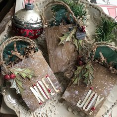 some ornaments are sitting on a plate with twine around the edges and tied together