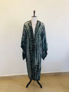 "A Beautiful Kimono Jacket,Robe . Long embroidered,silk,tie dyed and floaty ; A Perfect Cover Up for Holidays ,Festivals and Parties. This has been Handmade and Hand Dyed from a Vintage Indian Sari.... so is completely Unique and Sustainable. A Wonderfully Chic and Flattering Grey,Lavender and Black Design in Silk ,Embellished all over with swirls of Sparkling Silver Lurex Embroidery . The style is loose and edge to edge , with Gorgeous Square Kimono Sleeves. One Size S M L UK size 10 to 16 US 6 Spring Festival Kaftan With Natural Dye, Festival Kimono In Free Size With Long Sleeves, Long Sleeve Festival Kimono One Size, Long Spring Kaftan With Batik Print, One Size Long Sleeve Kimono For Festival, Long Batik Print Kaftan For Spring, Long Sleeve Free Size Kimono For Festival, Long Kaftan With Batik Print For Spring, Bohemian Hand Dyed Kimono For Spring