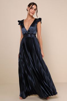 You're sure to be greeted with compliments from every direction when you arrive wearing the Lulus Exceptional Drama Navy Blue Satin Lace-Up Pleated Maxi Dress! Sleek woven satin, with luxe accordion pleats throughout, shapes a sleeveless bodice with ruffled shoulders, a plunging V-neckline, and a stunning lace-up back. Fitted waist tops a flaring skirt that ends at a maxi hem. Hidden zipper/clasp at back. Fit: This garment fits true to size. Length: Floor length. Size medium measures 60.25" from Black Tie Wedding Guest Dress, Navy Blue Bridesmaids, Best Maxi Dresses, Black Tie Attire, Navy Blue Maxi Dress, Accordion Pleats, Navy Blue Bridesmaid Dresses, Pleated Gown, Black Tie Wedding Guests