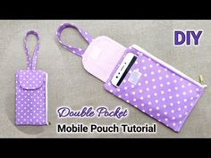 a purple polka dot cell phone case with a lanyard strap attached to it and the text double pocket mobile pouch