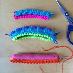 three different types of yarn and scissors on a table