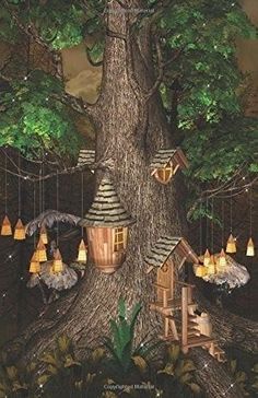 a tree house with lights hanging from it's sides