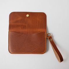 Wallets for Women: Wristlet Clutch | Leather by KMM & Co. Rectangular Leather Pouch With Interior Card Slots, Leather Clutch Pouch With Interior Card Slots, Leather Lined Wallet Pouch For Daily Use, Leather Lined Pouch Wallet For Daily Use, Leather Clutch With Coin Pocket In Brown, Leather Wallet With Leather Lining In Pouch Shape, Leather Wallet With Leather Lining, Brown Leather Clutch With Coin Pocket, Leather Coin Purse With Smooth Grain For Everyday Use