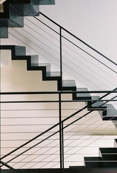 an image of a stair case that is in the process of being painted black and white