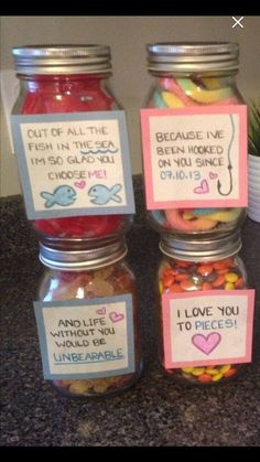 some jars filled with candy sitting on top of a counter