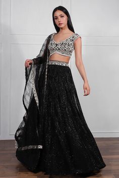 Black lehenga with all-over beaded embroidery. Comes with blouse and dupatta.
Component: 3
Embroidered
Neckline: Leaf
Sleeve Length: Cap
Fabric: Crepe Silk, Net
Color: Black
Bead, thread, resham and bugle embroidery
V-hem
Tie-up at the back with tassels
Embroidered dupatta
Closure:
Blouse: Hook closure at the back - Aza Fashions Ritika Mirchandani, Leaf Sleeve, Blouse Yoke, Lehenga Dupatta, Black Lehenga, Full Sleeve Blouse, Sharara Set, Embroidered Neckline, Embroidered Silk