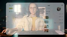 a woman with glasses is on a computer screen