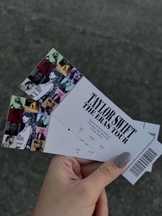 someone holding two tickets in their hand with the ticket for taylor swift and always's show