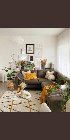 a living room filled with lots of furniture and decor