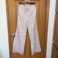 Victoria’s Secret White And Pink Striped Pajama Pants With Pink Lace Trim At The Bottom Of The Legs. Pants Feature Waist Pocket And Satin Waist Tie. Pink Cotton Wide Leg Sleepwear, Cotton Wide Leg Sleepwear For Pajama Party, Cotton Wide Leg Sleepwear For Lounging, Cotton Wide-leg Sleepwear For Lounging, Cotton Pants For Spring Sleepover, Pink Wide Leg Sleepwear For Loungewear, Wide Leg Cotton Sleepwear, Victoria's Secret Pink Pants For Loungewear, Spring Loungewear Pants By Victoria's Secret