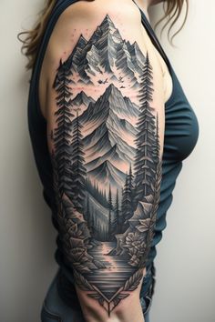 a woman with a mountain tattoo on her arm