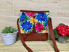 "This Mexican bag is a perfect accessory for any occasion. Each bag is a unique piece embroidered with bright colors and a very bohemian style. Each of our pieces are carefully crafted by artisans from the states of Oaxaca and Chiapas. Our items are made of cotton. We ship anywhere in the word, from Tepic, Nayarit, mx. Care Instructions: Please take care to handwash your items in cold water and hang to dry. Measurement in inches width 10\" high 10.75\" depth 1\"" Bohemian Crossbody Bag With Floral Embroidery, Multicolor Embroidered Bags For Vacation, Handmade Multicolor Embroidered Bags For Vacation, Embroidered Multicolor Shoulder Bag For Vacation, Handmade Multicolor Embroidered Shoulder Bag For Vacation, Handmade Multicolor Embroidery Bags For Vacation, Embroidered Brown Vacation Bag, Brown Embroidered Vacation Bag, Bohemian Multicolor Embroidery Bags As Gifts