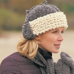 a woman wearing a knitted hat and scarf