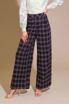 A woven plaid pant featuring a wide waist band, single front pleat, side pocket, and zipper closure. Matching top WHAT YOU NEED WOVEN PLAID TOP Details: Self: 100% Cotton Size & Fit - Model is 5`8" And Wearing Size Small- Measurements Taken From Size Small- Approx. Length: 42" Inseam - 30" Chic Plaid Wide Leg Pants, Chic Plaid Bottoms For Business Casual, Wide-leg Plaid Bottoms With Pockets, Plaid High-waisted Pants For Business Casual, Plaid Wide-leg Pants With Pockets, High-waisted Plaid Pants For Business Casual, Plaid Pants With Elastic Waistband For Work, Chic High-waisted Plaid Pants, Plaid Pants For Business Casual In Fall