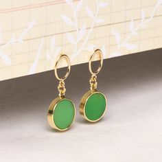 Chrysoprase Round Gemstone Drop Earrings - Stunning green and gold sophisticated minimalist jewelry for girlfriend, wife, mom, bff, aunt. Stone: Genuine Chrysoprase Bezel: Vermeil Gold Earring, ear-backs and post: 14k Gold Filled Earbacks: Included (14k Gold Filled) Total length of earring: 30mm Circle Gemstone: 12mm diameter About "Gold Filled Jewelry": Also called rolled-gold. These jewelry items are not actually filled with gold. They are made of a base metal covered by sheets of gold in a... Jewelry For Girlfriend, Thick Coat, Gemstone Drop Earrings, Writing Gifts, Gold Earring, Gold Filled Jewelry, Stone Earrings, Minimalist Jewelry, Base Metal