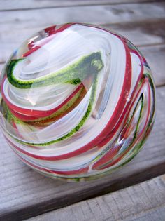 a glass bowl sitting on top of a wooden table