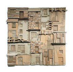 a piece of cardboard that is made to look like a building with windows and shutters