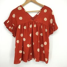 Buck List Polka Dot Print Ruffled Baby Doll Top. Size Medium V-Neck Ruffled Sleeves Slouchy Fit Lightweight Material Style # T1347b Color: Burnt Orange With Cream Dots Dropped Dolman Shoulder Condition: New With Tag B0225 Cute V-neck Blouse For Vacation, Casual Swiss Dot V-neck Blouse, Orange Short Sleeve Blouse With Ruffles, Orange Ruffled Short Sleeve Blouse, Cute V-neck Blouse For The Beach, Cute V-neck Blouse For Beach, Casual V-neck Swiss Dot Blouse, Polka Dot V-neck Tops For Summer, Polka Dot V-neck Top With Ruffles