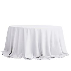 a white table cloth on top of a round table