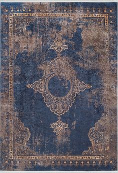 an old, faded rug with blue and brown colors