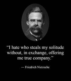 a man with glasses and a beard in front of a quote from fridach nitzche