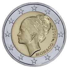 the commemorative coin for monaco is shown in gold and silver, with stars around it