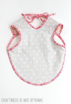 a bib with red and white polka dots on it