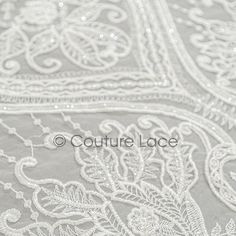 white lace with flowers and leaves on it